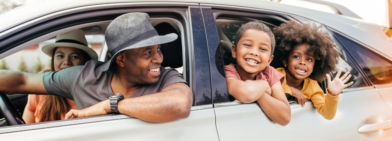 a man and boy looking out of a car window